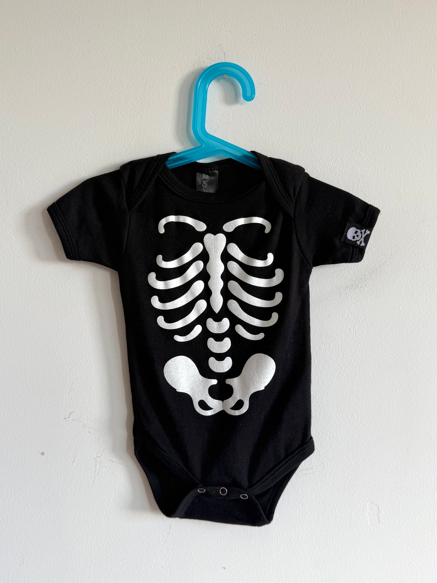 Skeleton print onesie