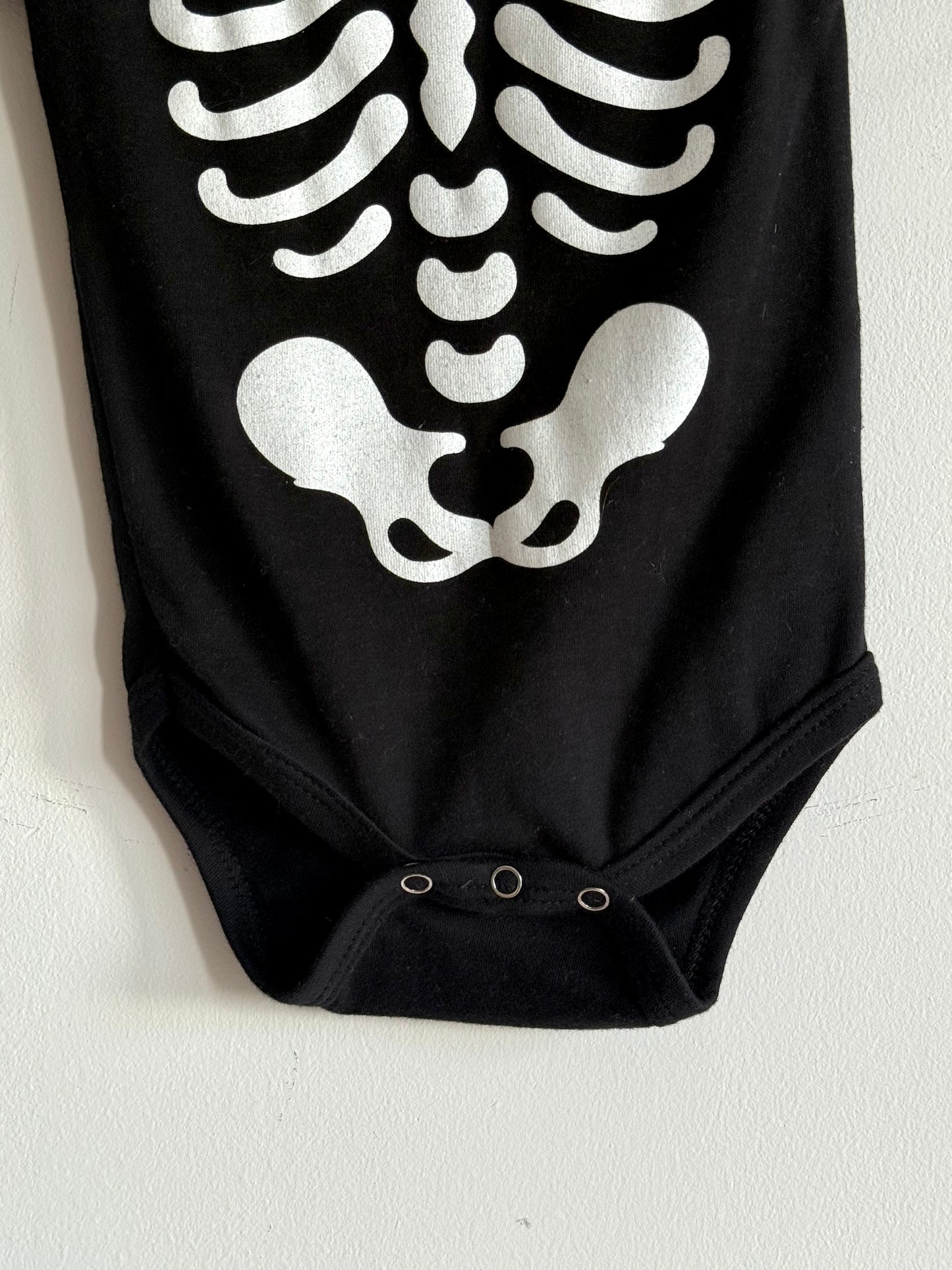 Skeleton print onesie