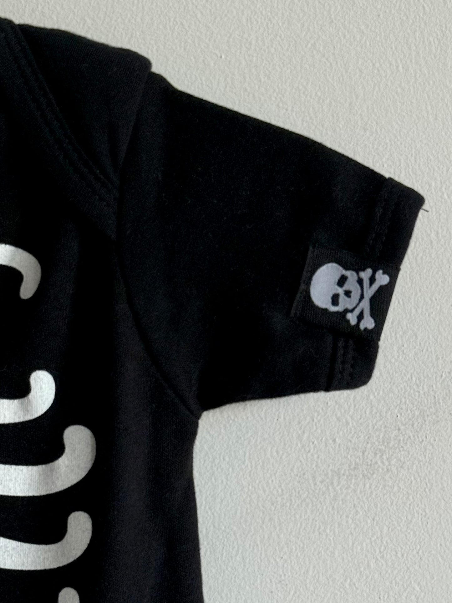 Skeleton print onesie